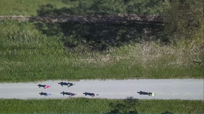 Group of four riders followed by fifth rider on Yarra Valley Trail birds eye view