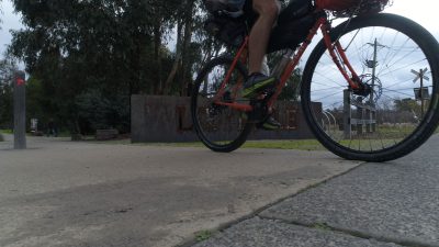 Commuter cyclist on orange bike leaving Lilydale